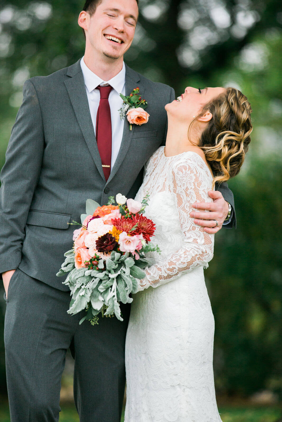 A bride and groom laugh together at their wedding in Three Forks Montana at the Sacajawea Hotel