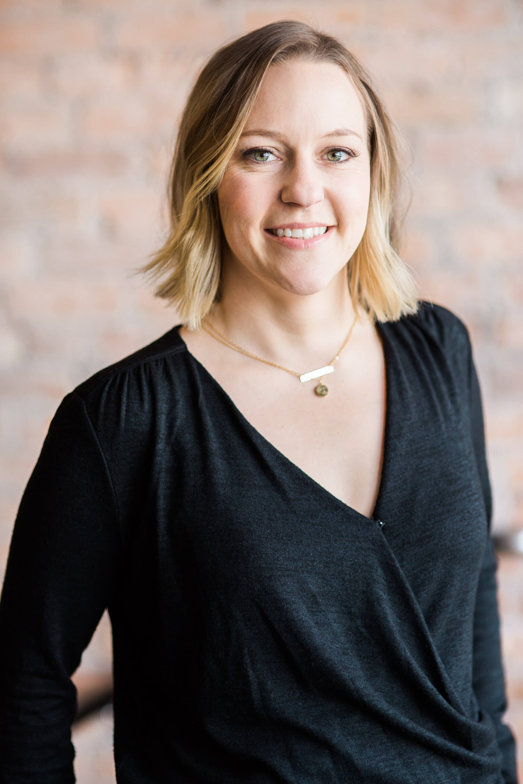 A woman poses for her headshot in Missoula Montana