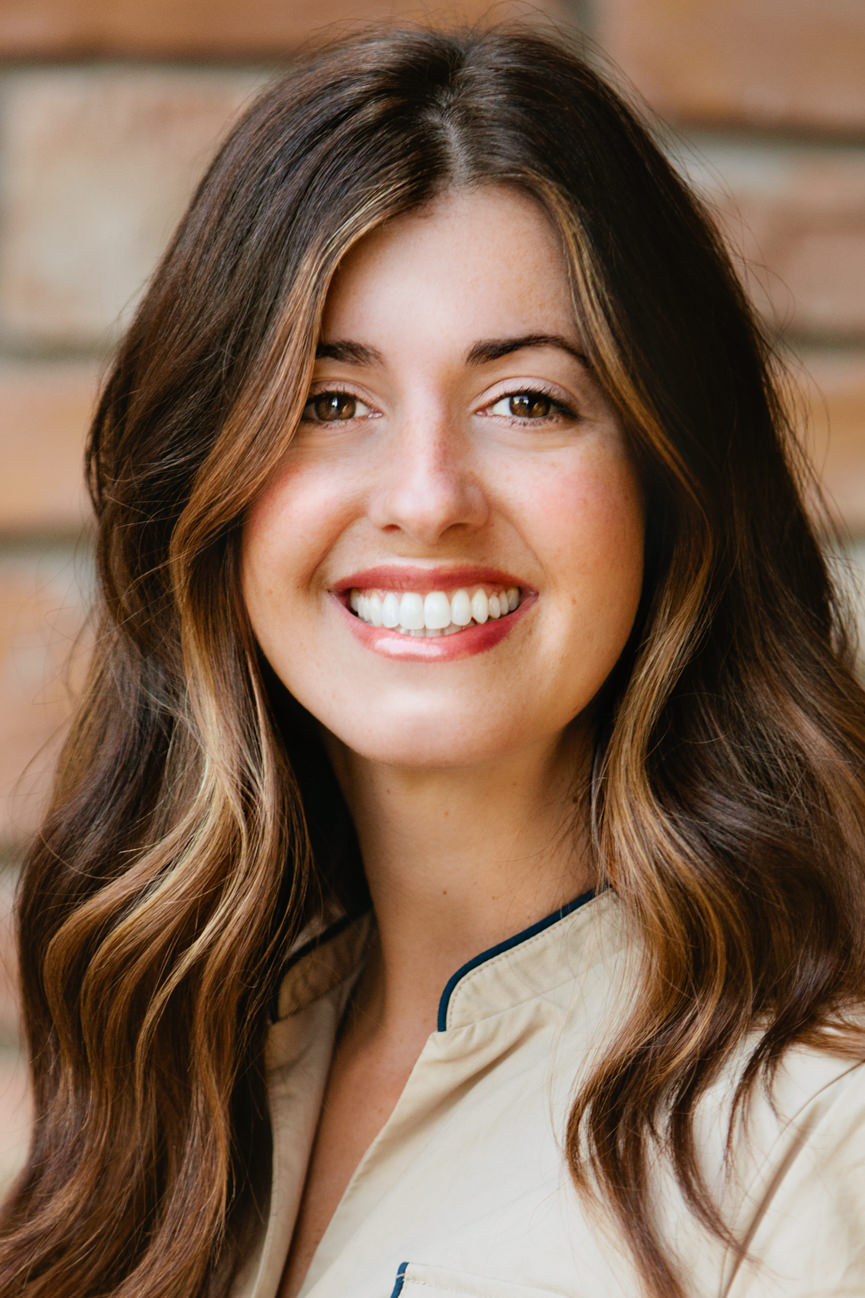 A female employee smiles for her headshots in Missoula Montana