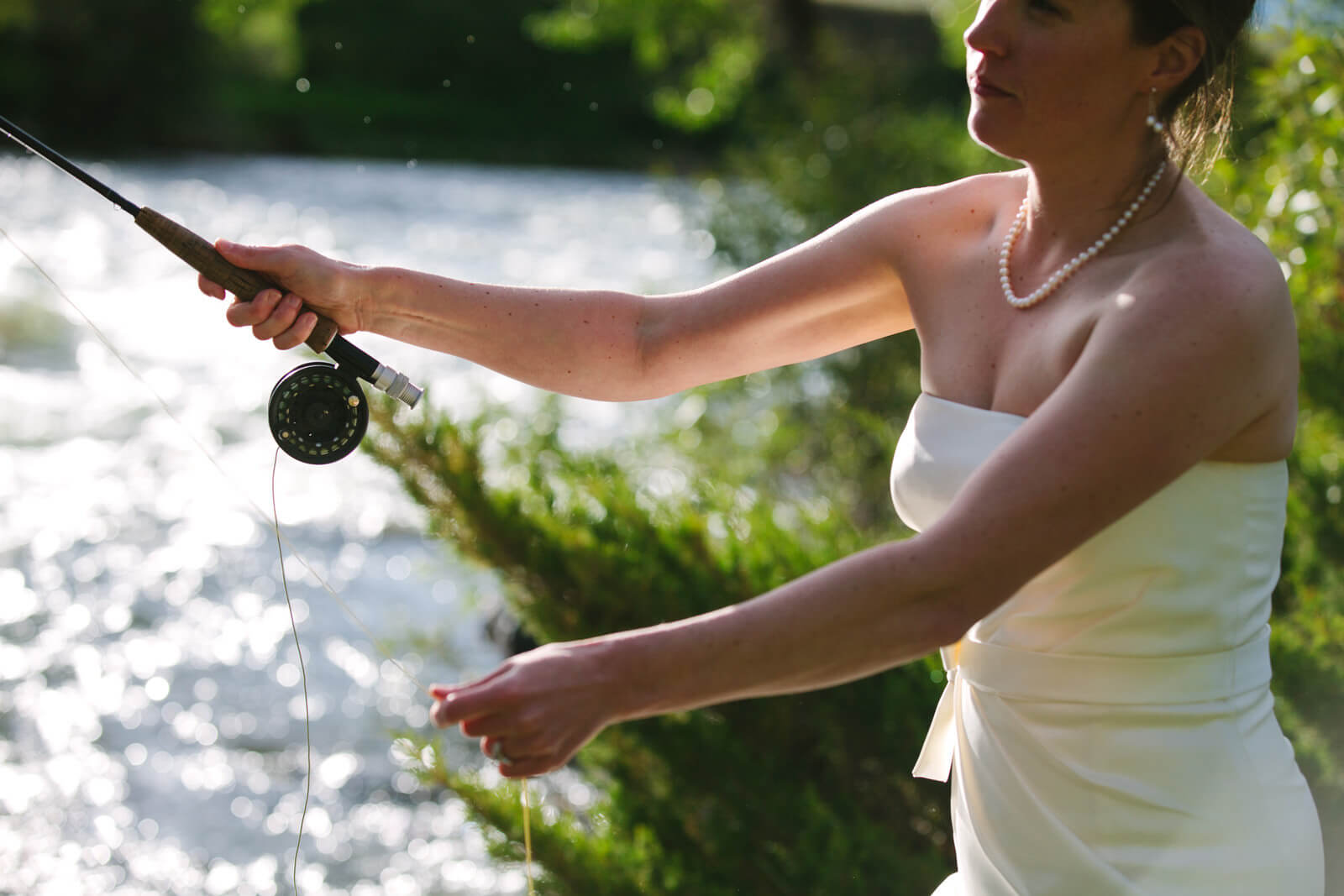 A bride flyfishes on her wedding day in Absaroka Montana