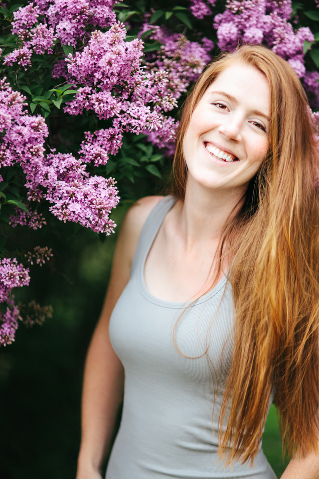 Kristine Paulsen Photography in front of blooming lilacs