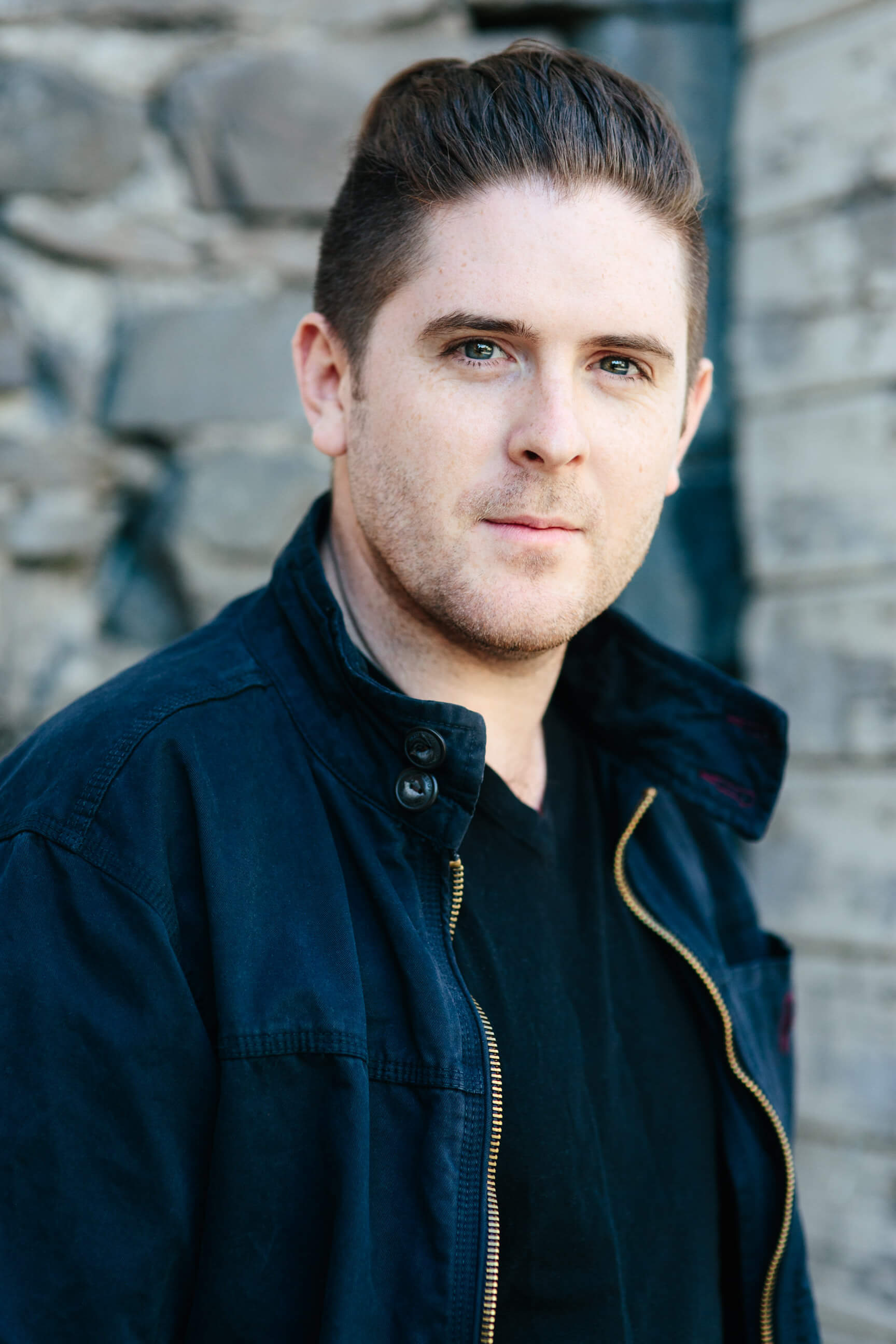 A male actor poses for his headshot in Missoula Montana