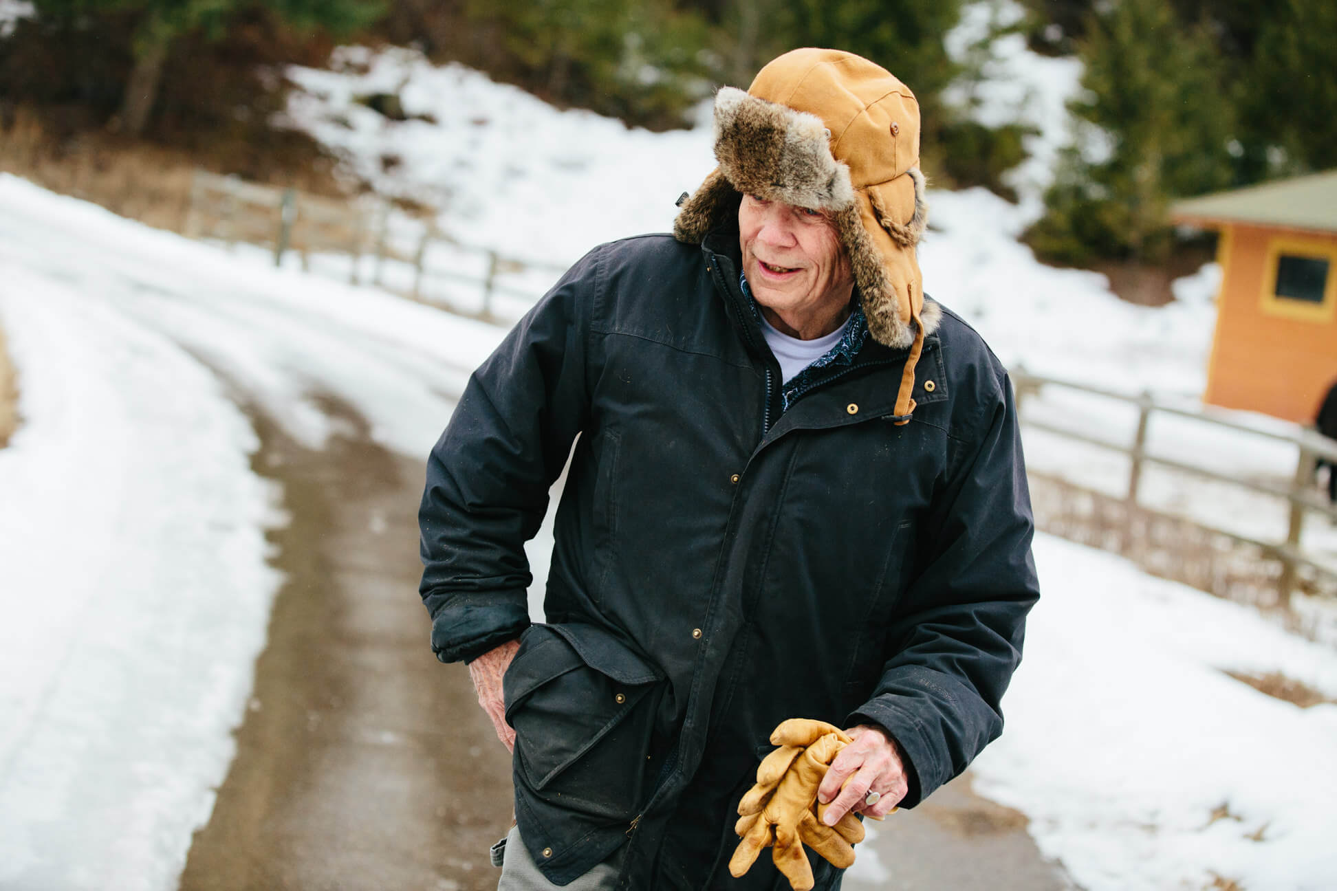 James Lee Burke walks down his driveway at his home in Lolo Montana