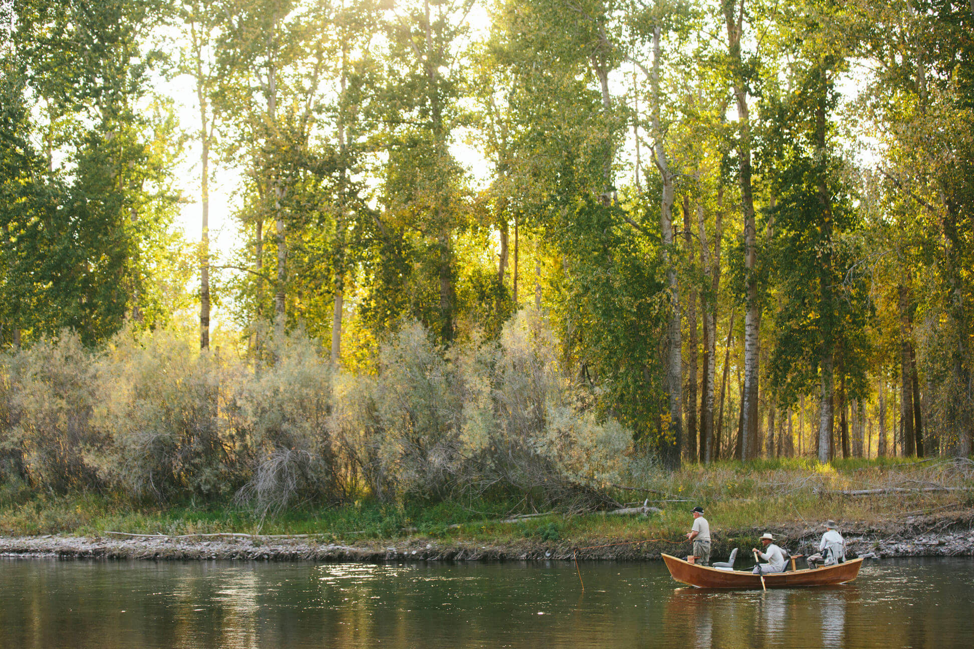 Fishermen row their boat along the Bitterroot River in Missoula Montana