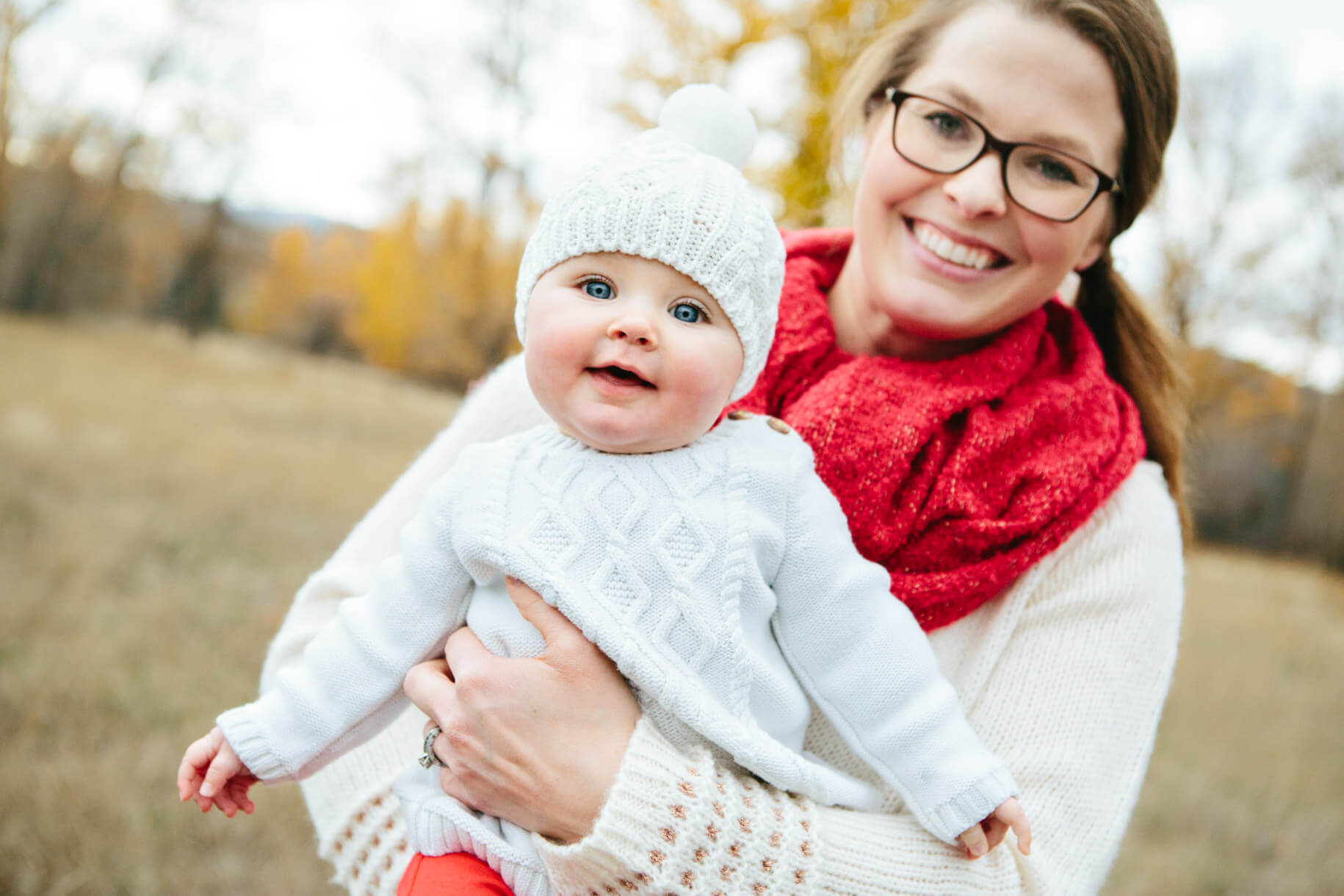 A mother holds her baby girl during their family photos in Lolo Montana