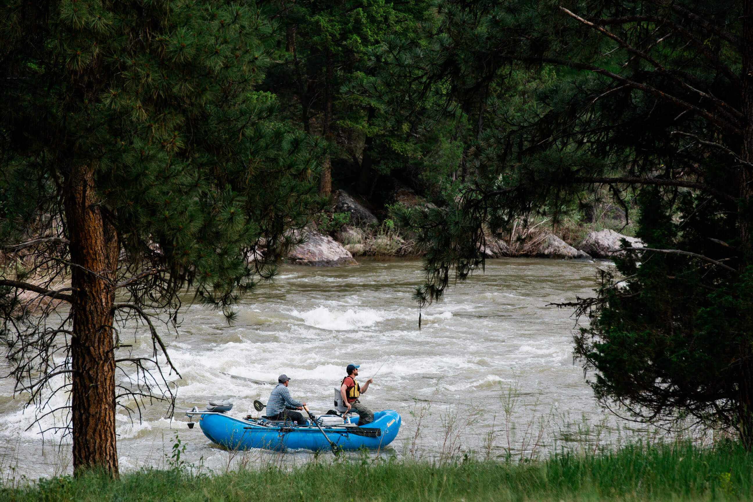 Fly fishermen raft down the Blackfoot River in Montana
