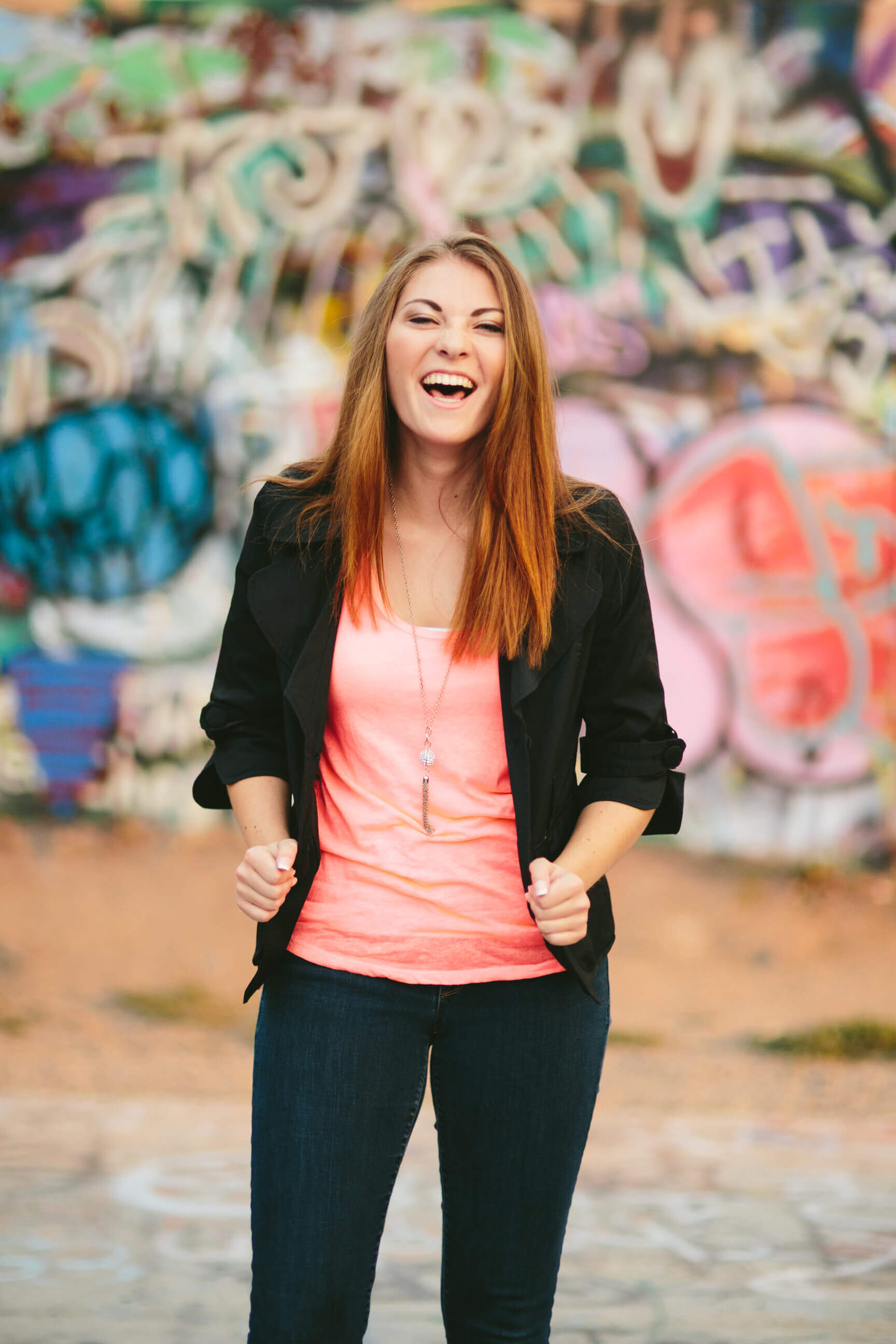 A senior girl laughs during her senior photos in Missoula Montana