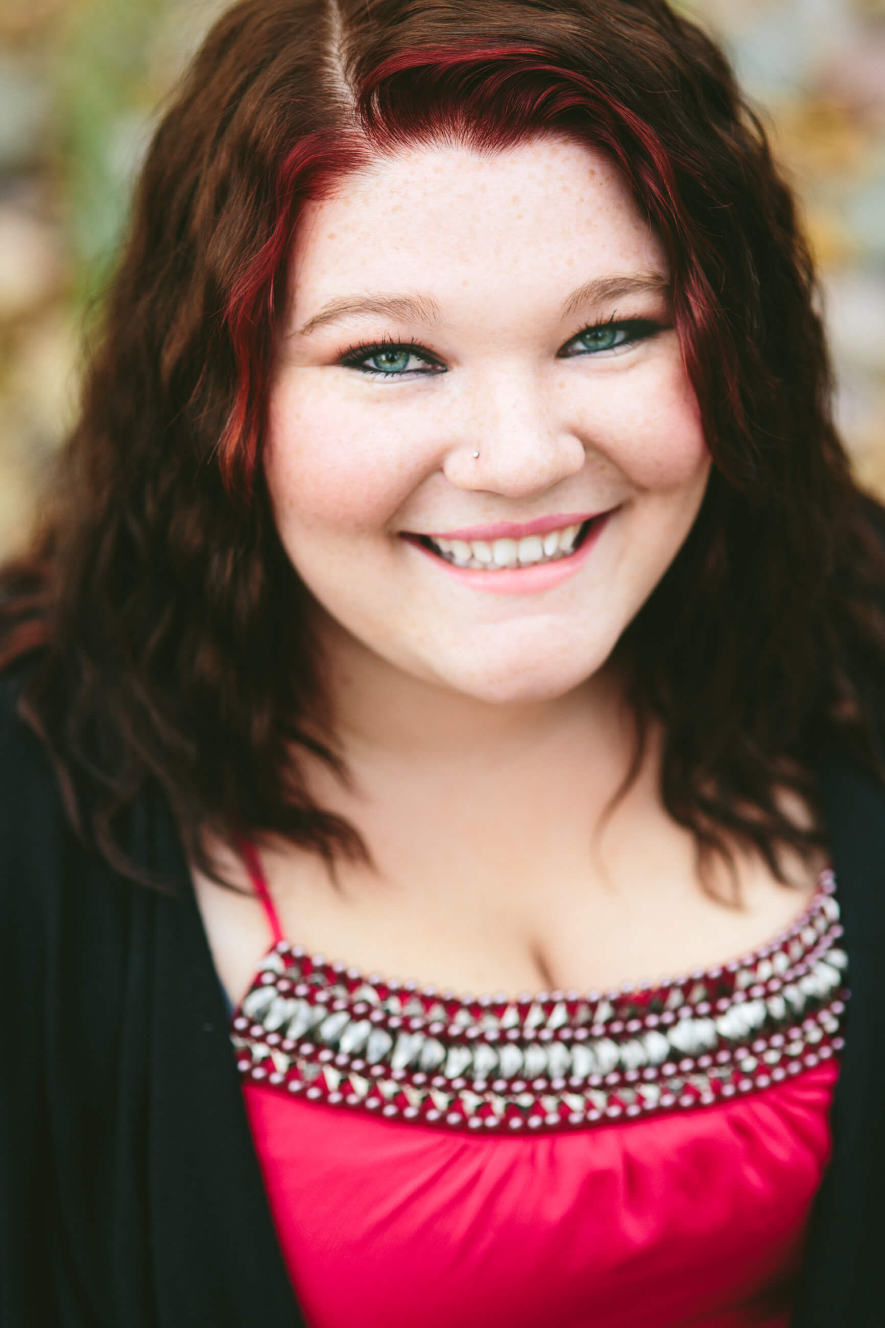 A senior girl smiles at the camera during her senior photos in Missoula Montana