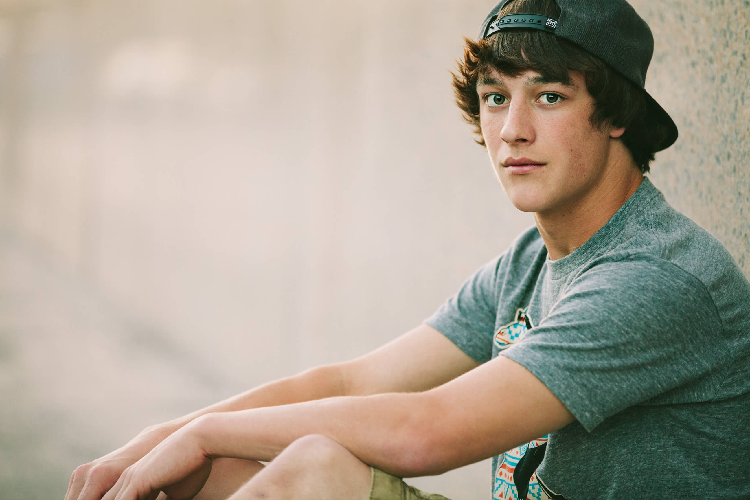 A senior boy looks at the camera during his Missoula senior photos