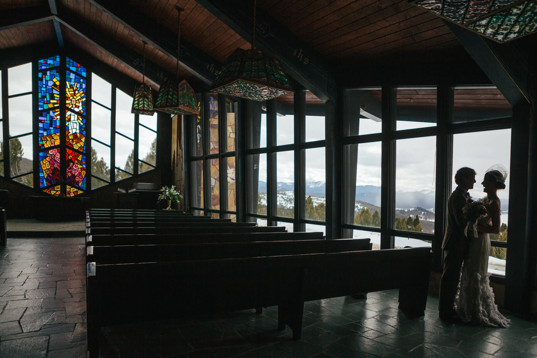 A bride and groom laugh during their Philpsburg elopement in Montana