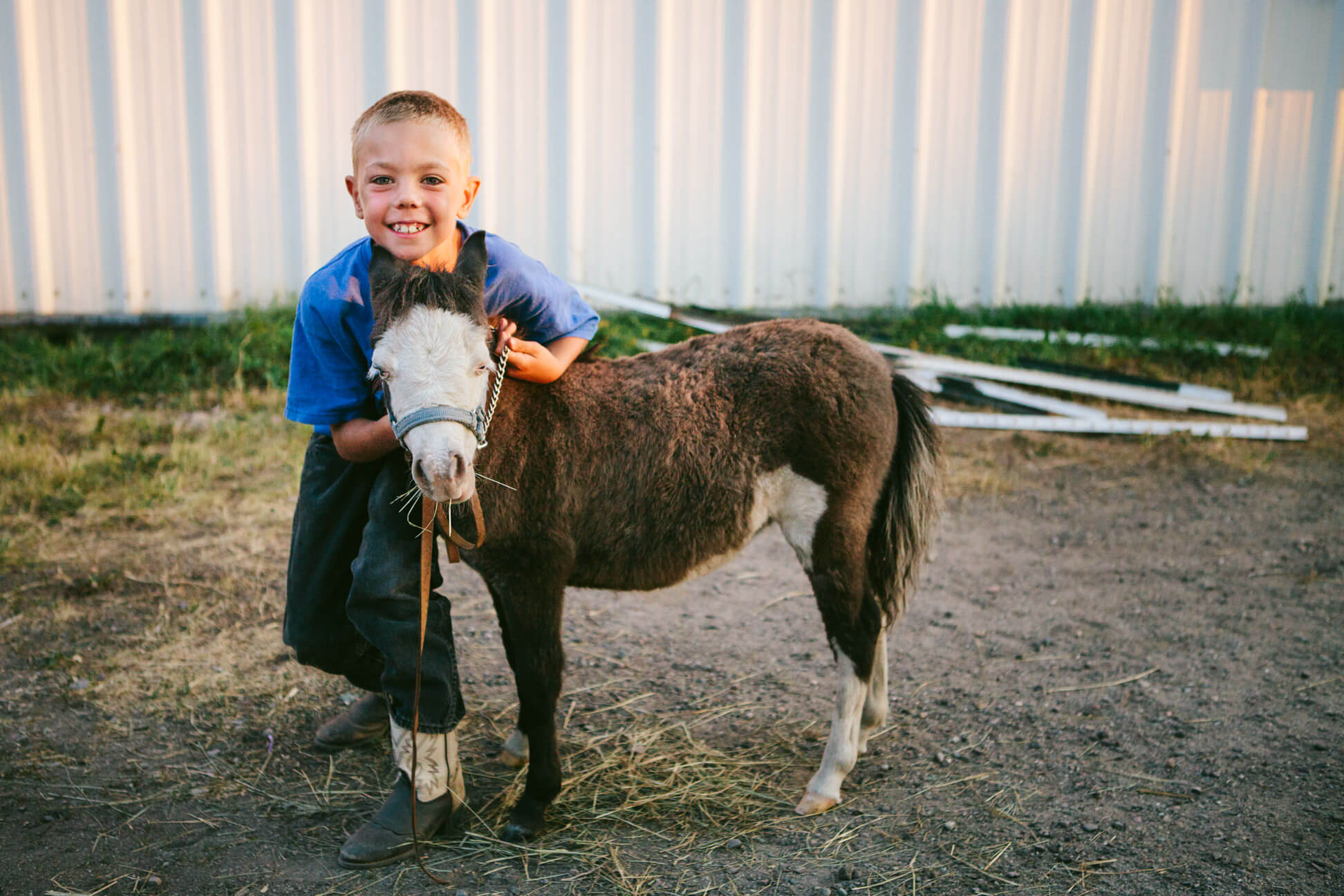 A boy smiles with his pony at the Western Montana State Fair in Missoula Montana