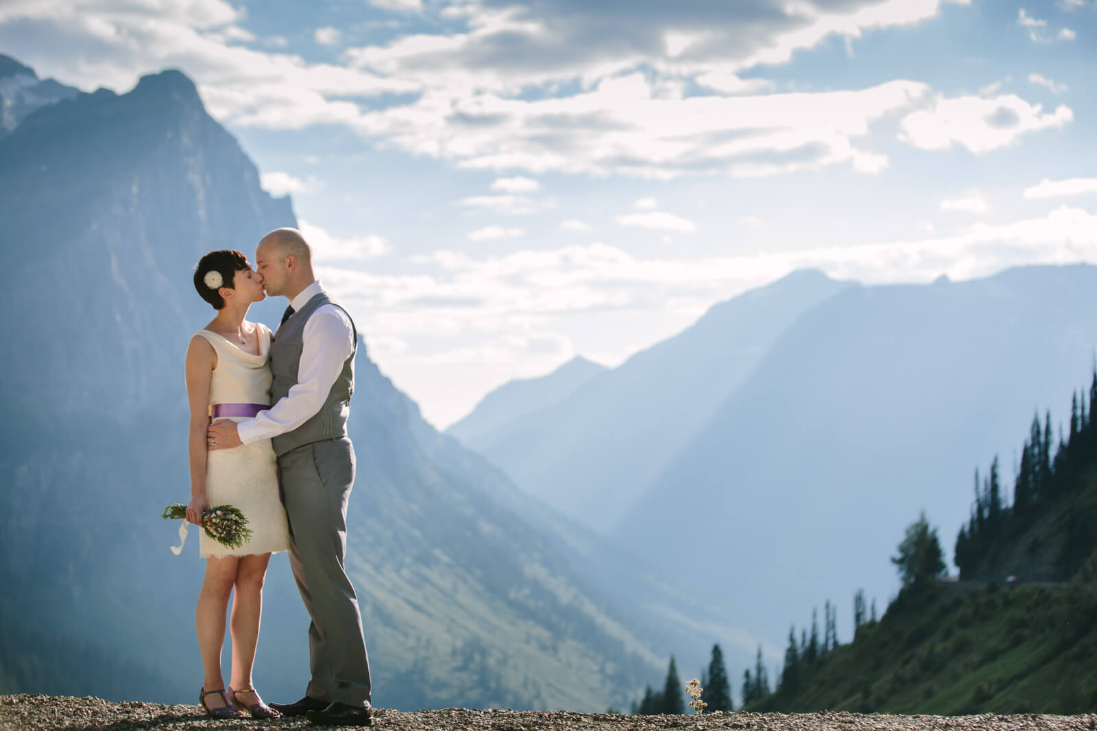 A bride and groom kiss at their elopement in Glacier National Park in Montana