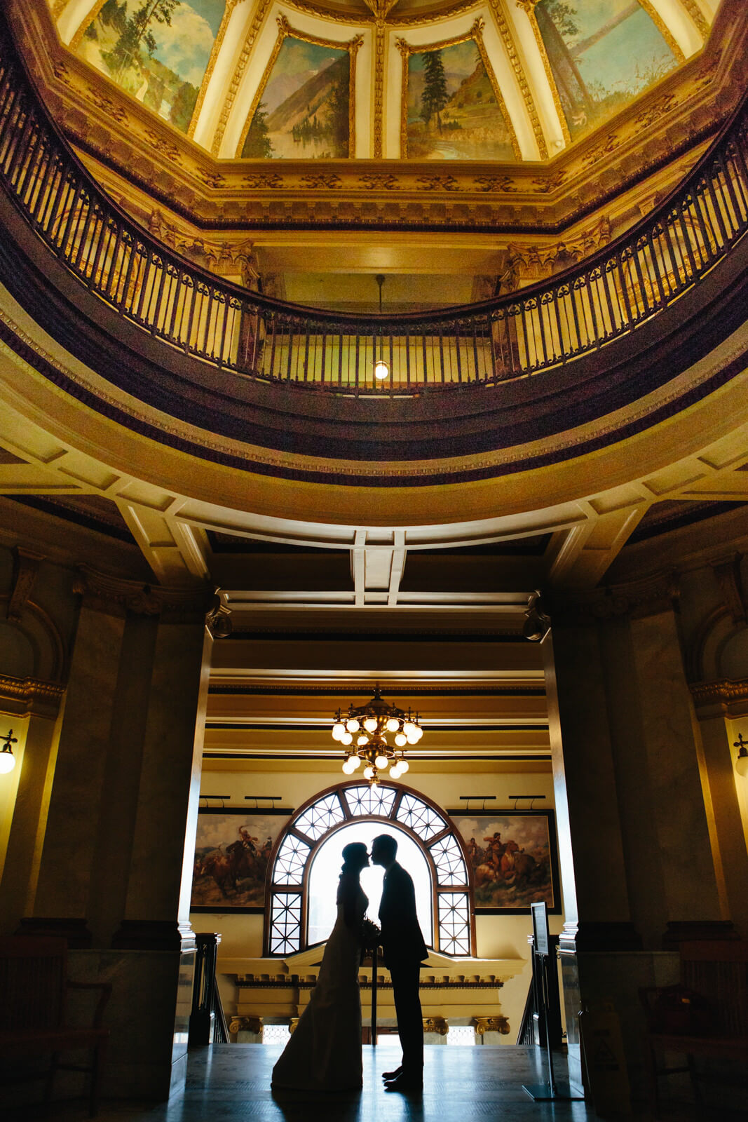 A bride and groom kiss during their wedding at the Missoula County Courthouse in Missoula Montana