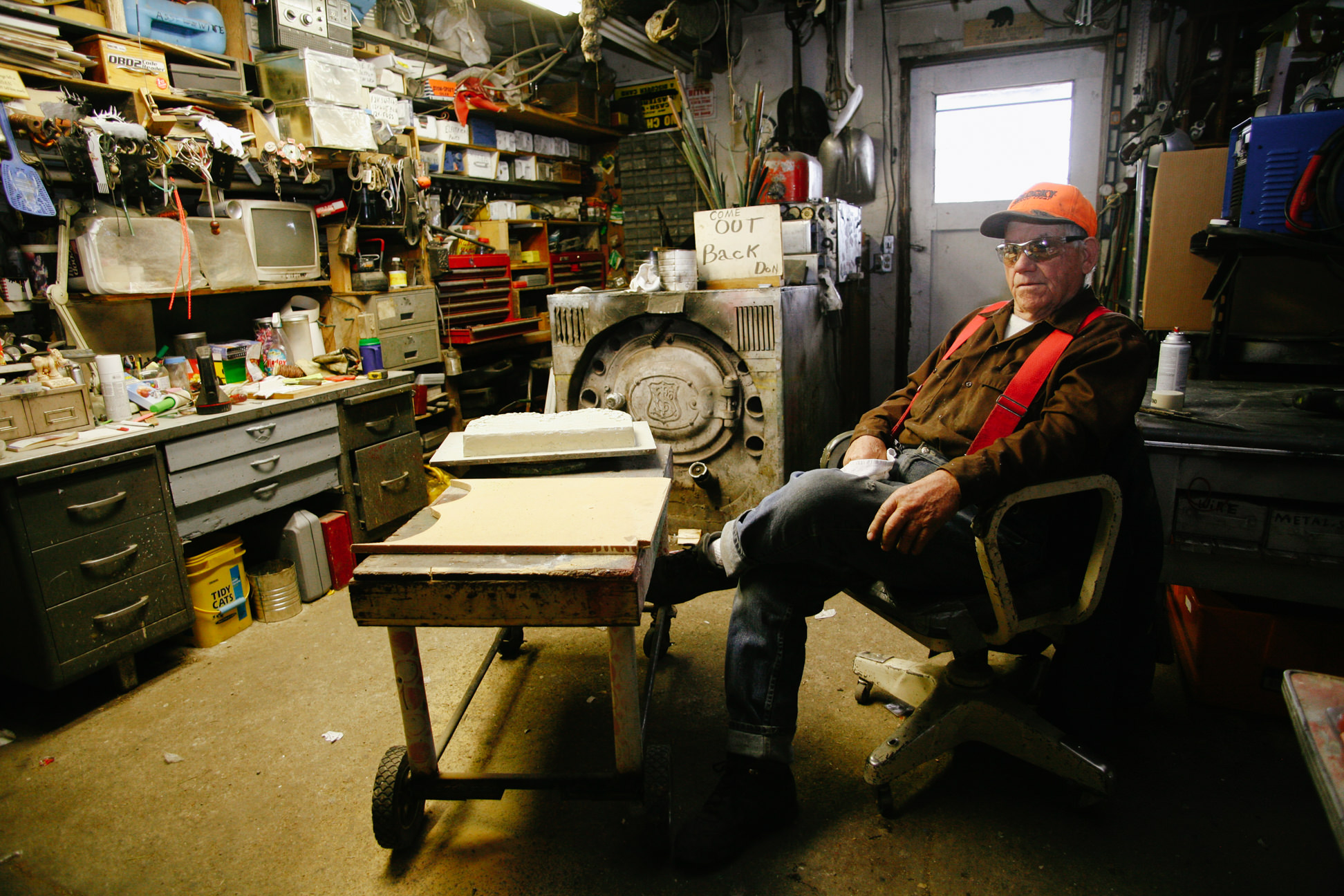 A man sits in his shop in Opportunity Montana