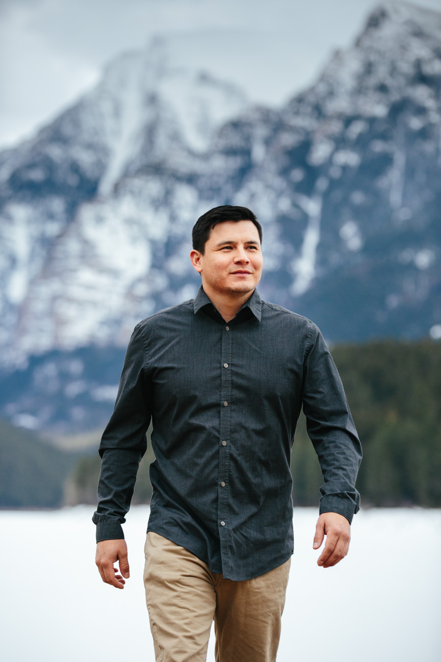 A man walks in front of the Mission Mountains in St Ignatius Montana