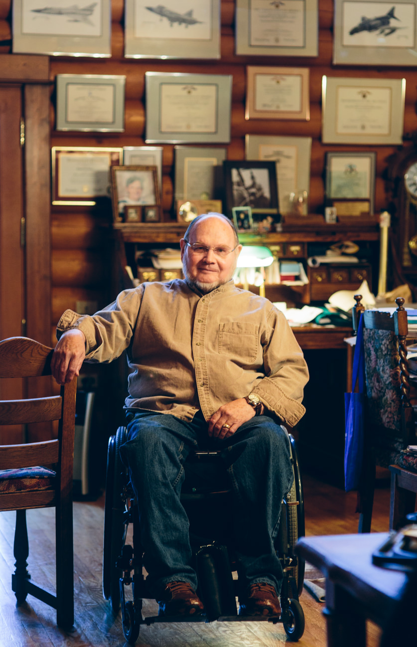 A man in a wheelchair poses for a photo for Paralyzed Veterans of America