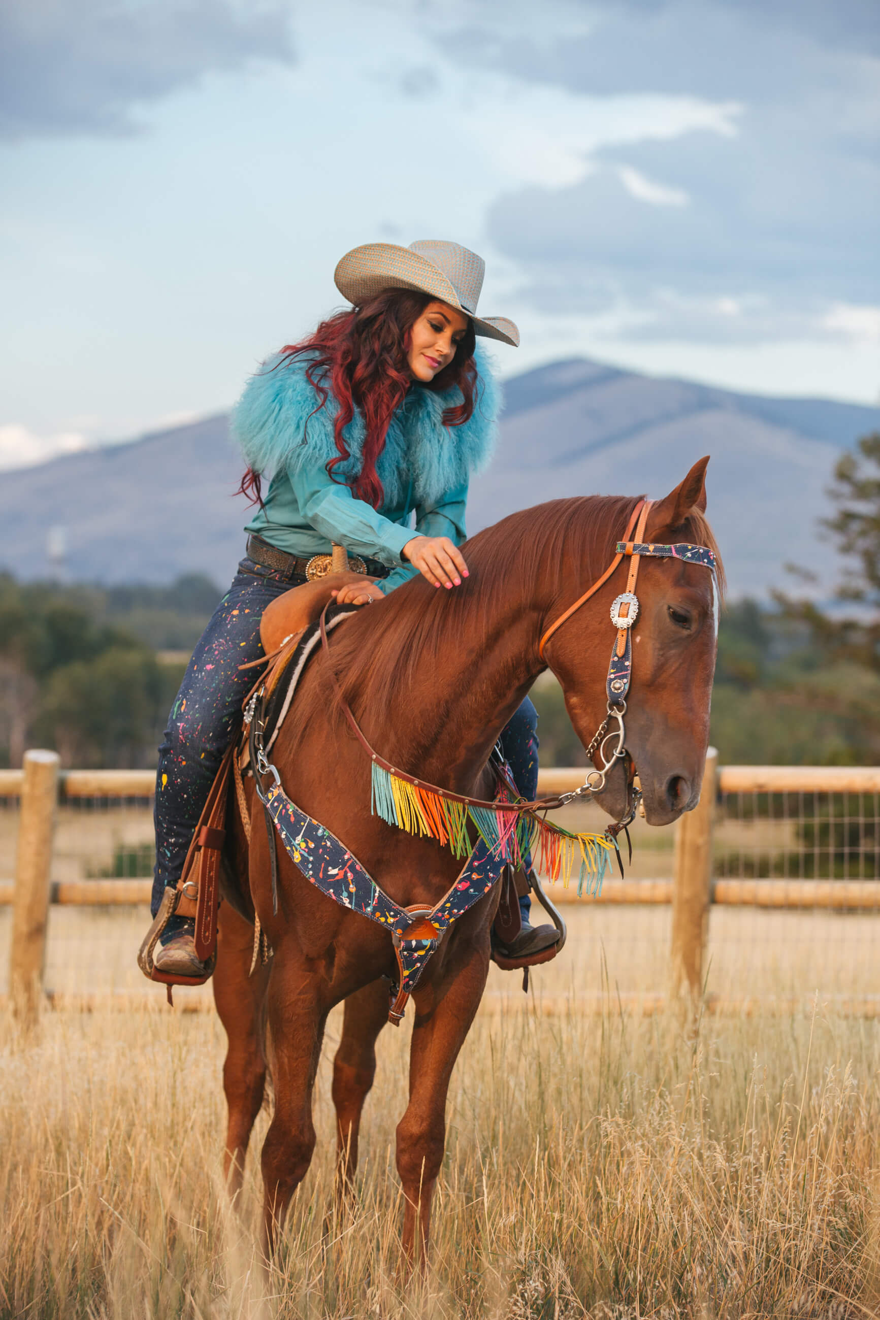 Fallon Taylor plays with the mane on her horse Babyflo in Missoula Montana
