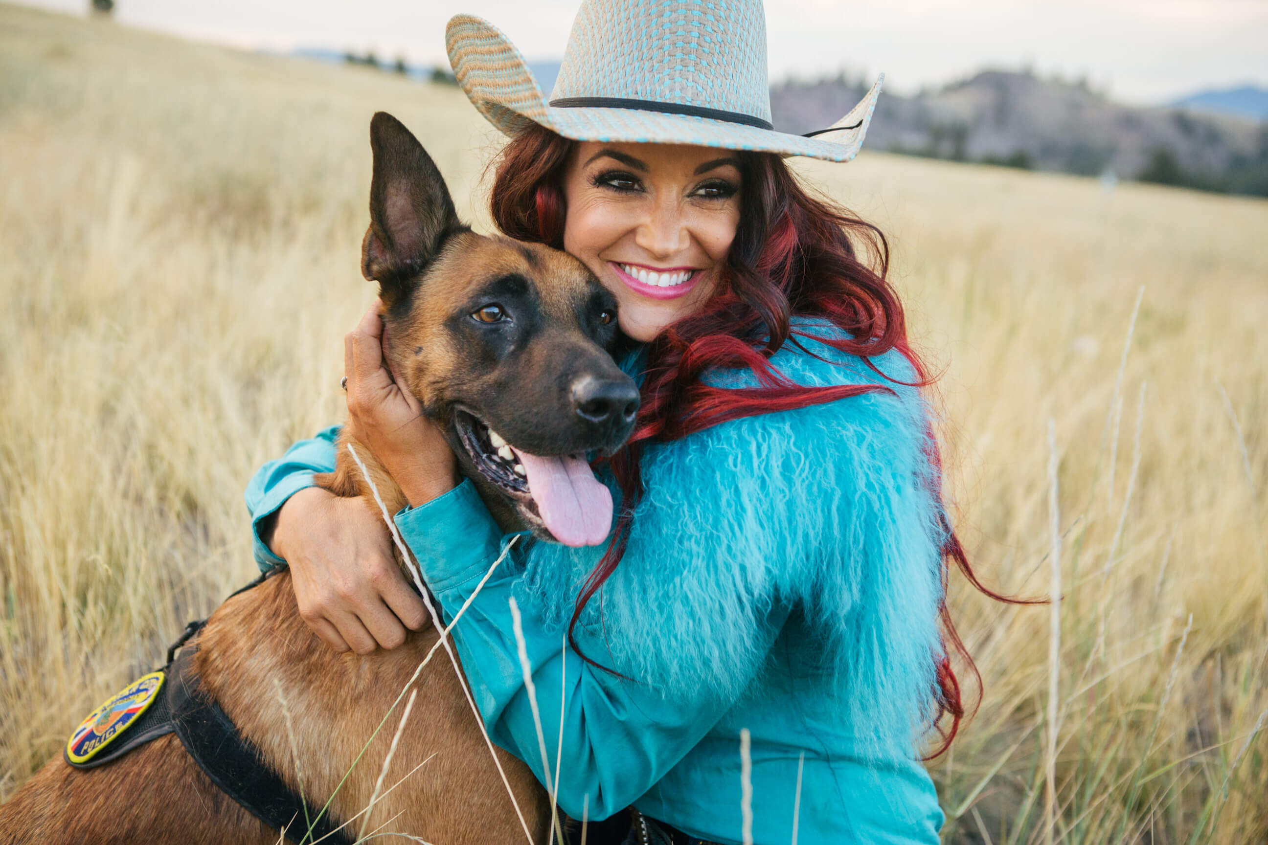 Fallon Taylor hugs her dog, Officer Rob, in Missoula Montana